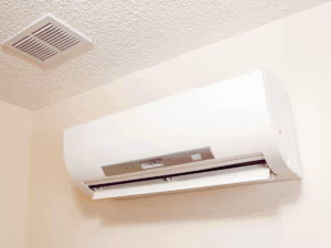 white mini split system on beige wall