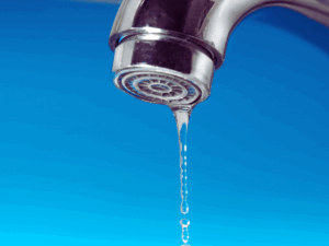 leaky faucet with blue background 