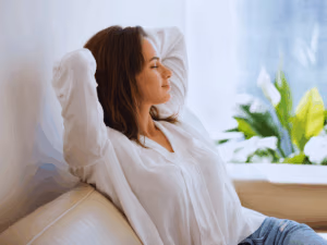 relaxed woman breathing in and enjoying indoor air quality