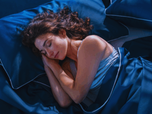 woman getting restful sleep because of improve indoor air quality