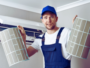 HVAC tech holding up dirty mini split filters 