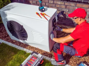 HVAC tech repairing faulty heat pump