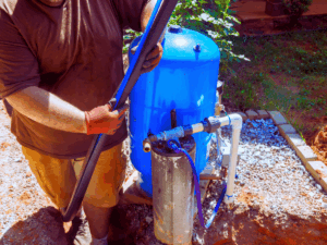Plumber installing whole home water filtration system